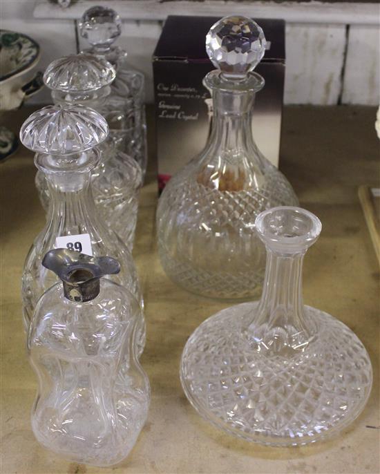 Seven cut glass decanters